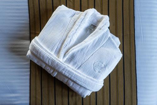 a white towel is sitting on a table at Zocalo Central & Rooftop Mexico City in Mexico City