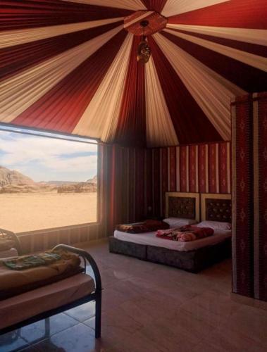 a room with two beds in a desert room at Wadi rum camp in Wadi Rum