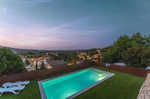 a swimming pool on the roof of a house at Piscina & BBQ | Cerca Costa Brava in Tordera
