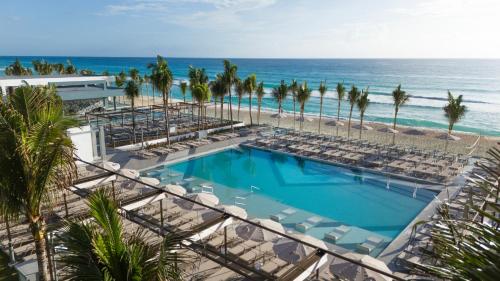 an overhead view of a swimming pool and the beach at Riu Ventura - All Inclusive in Cancún