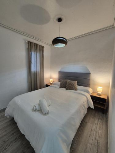 เตียงในห้องที่ SuecaRoom Prime Experience