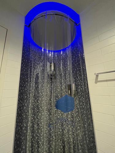 a bathroom with a shower with a blue ceiling at Stardust Boutique Hotel in Hua Hin