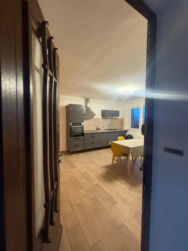 a kitchen and a dining room with a table at Maison DARDECH in Rochemaure