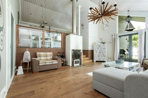a living room with a couch and a table at Villa Graniitti in Imatra