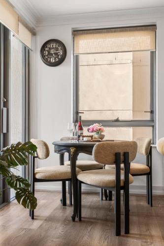 a dining room with a table and chairs at Sydney Harbourside Gem in Sydney