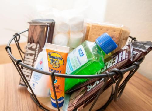 a wire basket filled with products on a table at Newly Remodeled Family Friendly Home in Page
