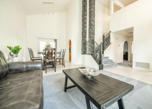 a living room with a couch and a table at Large Family Home with Game Room in Page