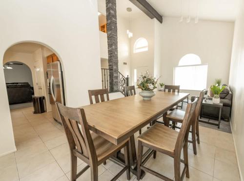 a dining room with a wooden table and chairs at Large Family Home with Game Room in Page