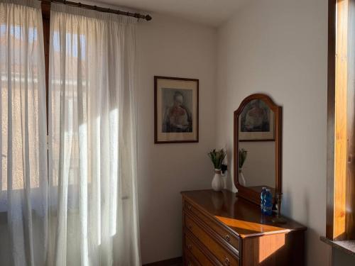 a room with a dresser and a mirror and a dresser at "The Moment"- rooms Bergamo center, self check-in, late Arrivals in Bergamo