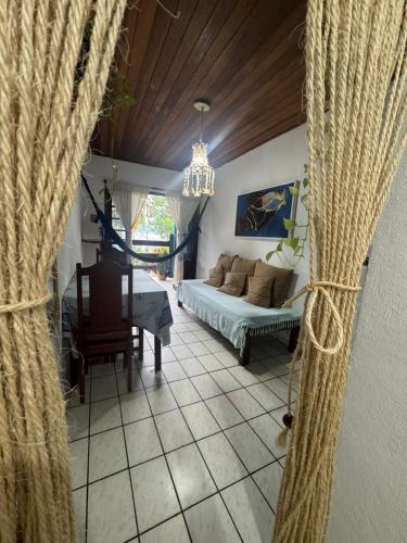 a living room with a bed and a table at Nova Conquista in Paraty