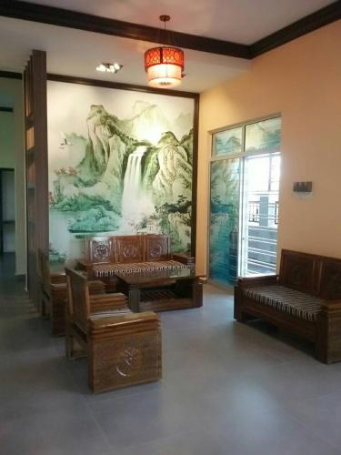 a room with a large mural of a waterfall at E-Home Kulai in Kulai