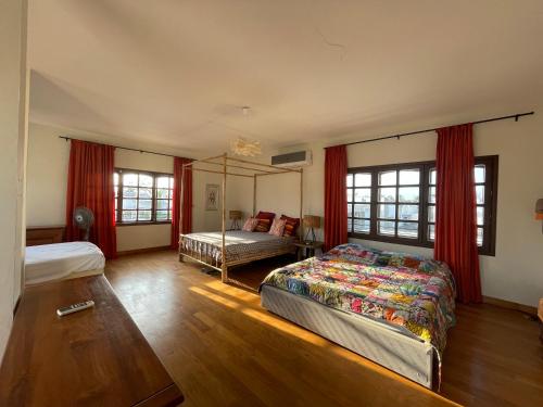 a bedroom with two beds and a bed sqor at Villa Chayol - Beautiful, spacious, bright! in Cotonou