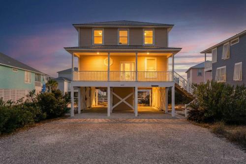 a large house with a balcony on top of it at Doc's Folly in Gulf Shores