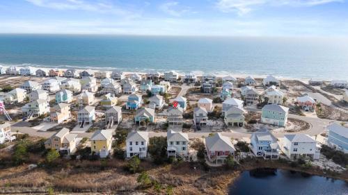 an aerial view of a residential neighborhood next to the ocean at Doc's Folly in Gulf Shores