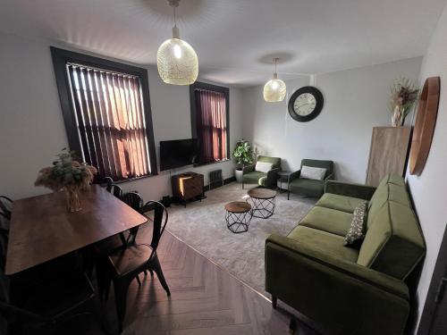 a living room with a couch and a table at Fabulous 3 Bed Apartment - Near Excel - Sleeps 6 - 8 in London