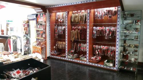 a store filled with lots of different types of merchandise at Hotel Valcarce Camino de Santiago in La Portela de Valcarce