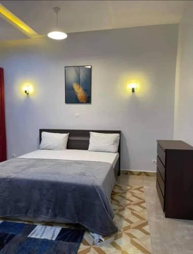 Llit o llits en una habitació de Appartement meuble