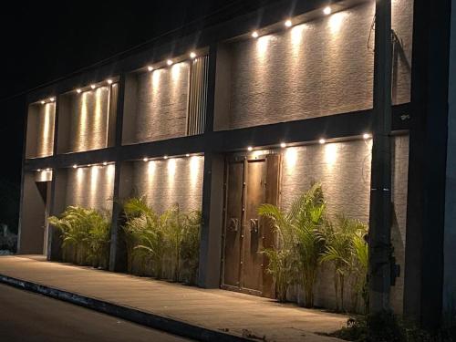 a building with lights on the side of it at Oasis Hotel Jojutla in Vallespin