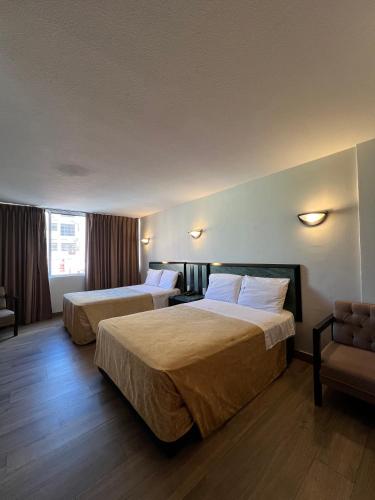 Postel nebo postele na pokoji v ubytování Hotel Universo