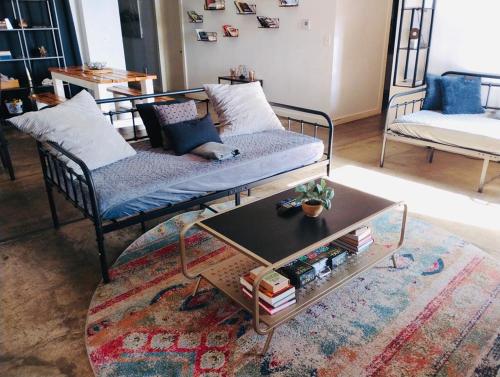 a living room with a couch and a coffee table at The Downtown Stadium Loft in Memphis