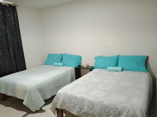 Lova arba lovos apgyvendinimo įstaigoje Hotel Mi Casa Mata