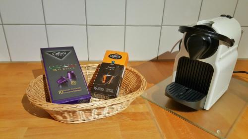 a basket of products sitting next to a coffee maker at Casa al Sasso in Bedigliora