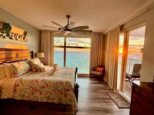 a bedroom with a bed with a view of the ocean at Sterling Reef 907 - Brent's Beach in Panama City Beach