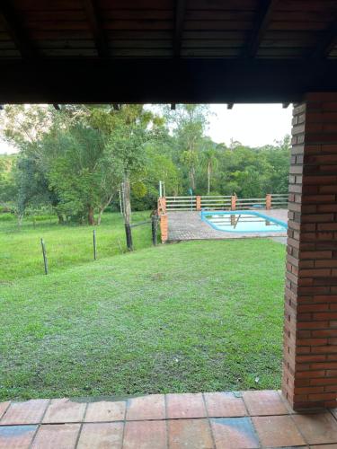 a view of a playground with a pool in a park at Recanto do sossego in Gravataí