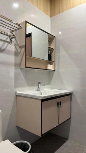 a bathroom with a sink and a mirror at Nature Resort Vangvieng in Vang Vieng