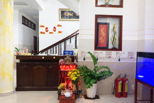 a lobby with a staircase in a building at Thanh Tâm Hotel in Can Tho