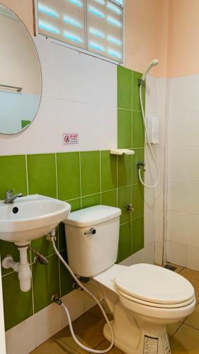 a bathroom with a toilet and a sink at Yada Resort Koh Yao Noi in Ko Yao Noi