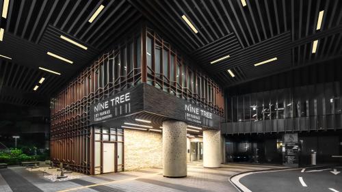 a large building with a sign on the side of it at Nine Tree by Parnas Seoul Insadong in Seoul