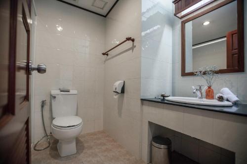 a bathroom with a toilet and a sink at Lao Orchid Hotel in Vientiane