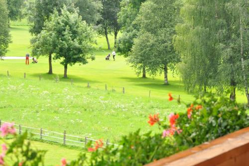 a view of a park with people in the grass at Haus Kössler in Radstadt