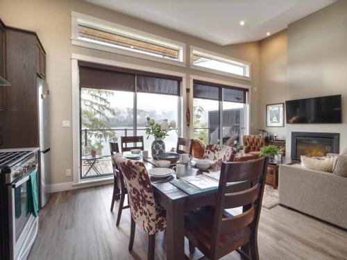 a kitchen and dining room with a table and chairs at Amazing Oceanfront & Eagle Views pet Friendly - 2 bath in Port Renfrew