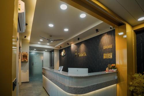 a lobby with a reception desk in a building at Hotel The Avanta - Gandhinagar in Gandhinagar