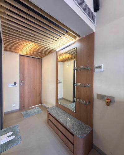 a bathroom with a sink and a mirror at Touchwood Bliss Nature Retreat - Igatpuri in Igatpuri