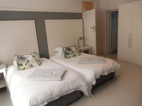 Cama o camas de una habitación en The Hampton Exclusive Guesthouse