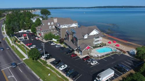 an aerial view of a large house with a parking lot at Cherry Tree Inn & Suites in Traverse City