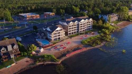 an aerial view of a resort near the water at Cherry Tree Inn & Suites in Traverse City