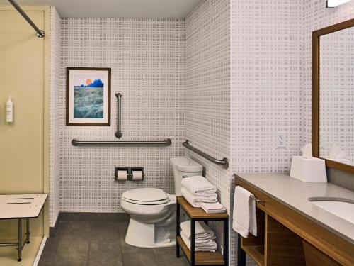 a bathroom with a toilet and a sink at Hampton Inn Pigeon Forge in Pigeon Forge
