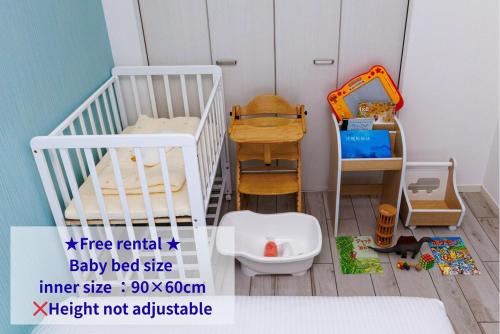 a toy room with two bunk beds and a toilet at Katan A in Yamada