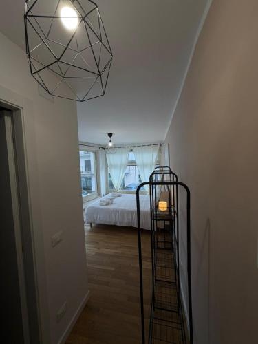 a bedroom with a bed and a light fixture at Rooms 78 in Castel di Sangro