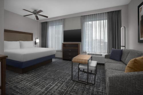 a hotel room with a bed and a couch at Homewood Suites by Hilton Washington DC NoMa Union Station in Washington, D.C.