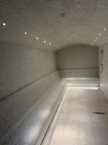 a empty room with a ceiling with lights on it at Sinaia Mountain View Residence Belleview in Sinaia