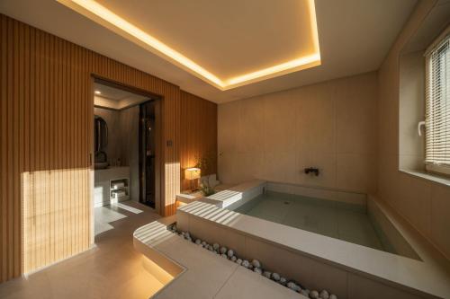 a large bath tub in a room with at 신북 온심재 in Sajŏng-dong