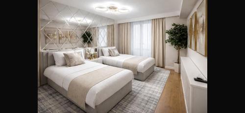 a hotel room with two beds in a room at Astral Court Premium Accomodation in Ruislip
