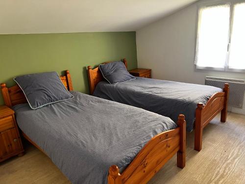 Llit o llits en una habitació de Gite Camélia