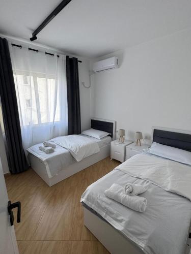 Cloud 4 Apartment tesisinde bir odada yatak veya yataklar