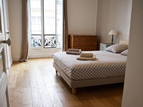 Voodi või voodid majutusasutuse "Le Jazzy" 3-bedroom apartment toas